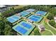 Aerial view of multiple tennis courts, providing ample space for players and spectators at 2400 Gants Hill Pl, Cumming, GA 30041