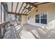 Covered back porch featuring wood flooring, beamed ceiling, screen door, and lots of light from windows at 4211 Burnt Hickory Nw Rd, Marietta, GA 30064