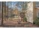 Landscaped backyard featuring a serene lake view and an inviting screened porch at 4211 Burnt Hickory Nw Rd, Marietta, GA 30064