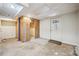 Unfinished basement featuring an exit door and concrete floor at 4211 Burnt Hickory Nw Rd, Marietta, GA 30064
