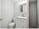 Bathroom with a toilet, vanity with storage, and mirror cabinet at 4211 Burnt Hickory Nw Rd, Marietta, GA 30064