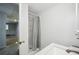 Bathroom featuring a shower with a curtain, granite counter top sink, and an open door at 4211 Burnt Hickory Nw Rd, Marietta, GA 30064