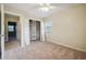Carpeted bedroom with natural light, open closet, a ceiling fan, and access to other rooms in the house at 4211 Burnt Hickory Nw Rd, Marietta, GA 30064