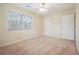 Bright bedroom featuring a ceiling fan, large window with blinds, and neutral-colored walls at 4211 Burnt Hickory Nw Rd, Marietta, GA 30064
