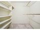 Walk-in closet with built-in shelving and hanging rods, offering ample storage space at 4211 Burnt Hickory Nw Rd, Marietta, GA 30064