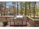 Deck with a stainless steel barbecue grill and outdoor cabinets overlooking a lake at 4211 Burnt Hickory Nw Rd, Marietta, GA 30064