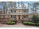Charming two-story home boasts a welcoming front porch and landscaped yard, perfect for outdoor enjoyment at 4211 Burnt Hickory Nw Rd, Marietta, GA 30064