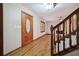 Inviting foyer with hardwood floors, a decorative front door, and a staircase leading to the upper level at 4211 Burnt Hickory Nw Rd, Marietta, GA 30064