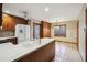 Bright kitchen with knotty pine cabinets, a center island, stainless appliances, and a dining area with a large window at 4211 Burnt Hickory Nw Rd, Marietta, GA 30064
