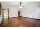 Expansive living room featuring polished hardwood floors, white walls, and natural lighting from large windows at 4211 Burnt Hickory Nw Rd, Marietta, GA 30064