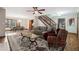 Cozy living room with a decorative rug and a view of the dining area and wooden staircase at 4211 Burnt Hickory Nw Rd, Marietta, GA 30064