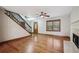 Open living space with hardwood floors, a fireplace, and a staircase, offering a blend of comfort and architectural detail at 4211 Burnt Hickory Nw Rd, Marietta, GA 30064