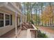 Porch overlooking a yard with large trees and a lake at 4211 Burnt Hickory Nw Rd, Marietta, GA 30064