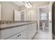 Bathroom with granite countertops, double sinks, and neutral paint at 4884 Kentwood Dr, Marietta, GA 30068