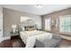 Cozy bedroom with hardwood floors, natural light, and neutral decor at 4884 Kentwood Dr, Marietta, GA 30068