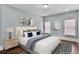 Comfortable bedroom with hardwood floors, natural light, and neutral decor at 4884 Kentwood Dr, Marietta, GA 30068