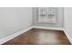 Neutral room with hardwood floors, crisp, white trim, and shuttered windows at 4884 Kentwood Dr, Marietta, GA 30068