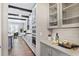 Modern eat-in kitchen featuring gray cabinets, stainless steel appliances, and hardwood floors at 4884 Kentwood Dr, Marietta, GA 30068