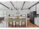 Modern kitchen with white cabinetry, stainless steel appliances, and a large center island with bar seating at 4884 Kentwood Dr, Marietta, GA 30068