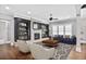 Comfortable living room with a fireplace, built-in shelving, ample seating, and natural light at 4884 Kentwood Dr, Marietta, GA 30068