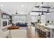 Open-concept living space with a cozy fireplace, built-in bookshelves, and seamless flow to the kitchen at 4884 Kentwood Dr, Marietta, GA 30068