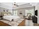 Spacious main bedroom featuring tray ceiling, hardwood floors, and sitting area at 4884 Kentwood Dr, Marietta, GA 30068