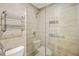 Tiled bathroom with walk-in shower featuring glass doors and tiled accents at 228 Smokerise Se Cir, Marietta, GA 30067