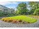 Beautiful exterior view with a grassy lawn and garden of an apartment building with balconies at 228 Smokerise Se Cir, Marietta, GA 30067