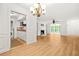 Open-concept living space featuring a fireplace, built-in shelving, and an adjoining kitchen and dining area at 228 Smokerise Se Cir, Marietta, GA 30067