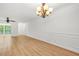 Spacious living room featuring wood-look floors, decorative molding, and recessed lighting at 228 Smokerise Se Cir, Marietta, GA 30067