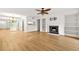 Bright living room featuring a fireplace, built-in shelving, and hardwood floors at 228 Smokerise Se Cir, Marietta, GA 30067