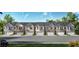 Charming townhome exteriors featuring brick and stone accents, attached garages, and landscaped surroundings at 3041 Greyton Dr, Buford, GA 30519