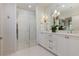 Modern bathroom featuring a glass-enclosed shower, double vanity, and elegant fixtures at 3481 Landen Pine Ne Ct, Atlanta, GA 30305
