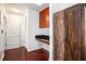 Hallway area featuring hardwood floors, built in shelving, and storage with convenient access to entry doors at 361 17Th Nw St # 2407, Atlanta, GA 30363