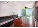 Modern kitchen boasts stainless steel appliances, granite countertops, and hardwood floors at 361 17Th Nw St # 2407, Atlanta, GA 30363