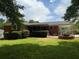 This backyard features a grassy lawn, shed and covered porch at 2190 Olive Springs Se Rd, Marietta, GA 30060
