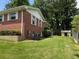 Expansive backyard features lush green lawn and mature trees surrounding the property at 2190 Olive Springs Se Rd, Marietta, GA 30060