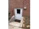 Brick wall with basement entrance and concrete steps at 2190 Olive Springs Se Rd, Marietta, GA 30060