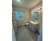 The bathroom features a single sink vanity with a decorative shower curtain at 2190 Olive Springs Se Rd, Marietta, GA 30060