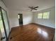 This cozy bedroom features hardwood floors, a ceiling fan, and abundant natural light at 2190 Olive Springs Se Rd, Marietta, GA 30060