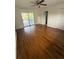 This cozy bedroom features hardwood floors and a glass patio door for natural light at 2190 Olive Springs Se Rd, Marietta, GA 30060