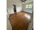 This cozy bedroom features hardwood floors, a ceiling fan, and abundant natural light at 2190 Olive Springs Se Rd, Marietta, GA 30060
