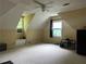 Large bedroom area with windows, and ceiling fan, offering a blank canvas for design and comfort at 2413 Charleston Oaks Ln, Decatur, GA 30030