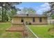 View of the backyard with a garden bed and a fenced-in area for outdoor enjoyment at 2631 Rolling Hills Way, Conyers, GA 30094