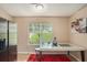 Bright kitchen area with stainless steel refrigerator and breakfast table near a bright sunny window at 2631 Rolling Hills Way, Conyers, GA 30094