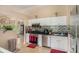 Traditional kitchen featuring white cabinets, stainless steel appliances, and decorative tile backsplash at 2631 Rolling Hills Way, Conyers, GA 30094