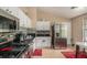 Modern kitchen featuring stainless steel appliances, dark countertops, and stylish tiled backsplash at 2631 Rolling Hills Way, Conyers, GA 30094