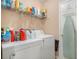 Laundry room featuring full size washer and dryer and plenty of shelves for storage at 2631 Rolling Hills Way, Conyers, GA 30094