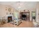 Elegant living room with a fireplace, hardwood floors, ample lighting, and stylish decor at 2631 Rolling Hills Way, Conyers, GA 30094