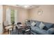 Living room featuring a comfortable blue couch and table set for board games at 2631 Rolling Hills Way, Conyers, GA 30094